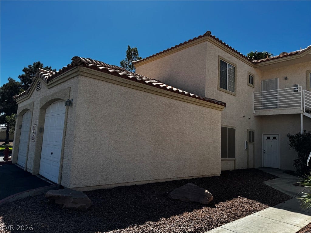 1900 N Torrey Pines Drive, #101, Las Vegas, NV 89108 Stucco exterior finishes and tiled roofing capture classic desert architectural styling.