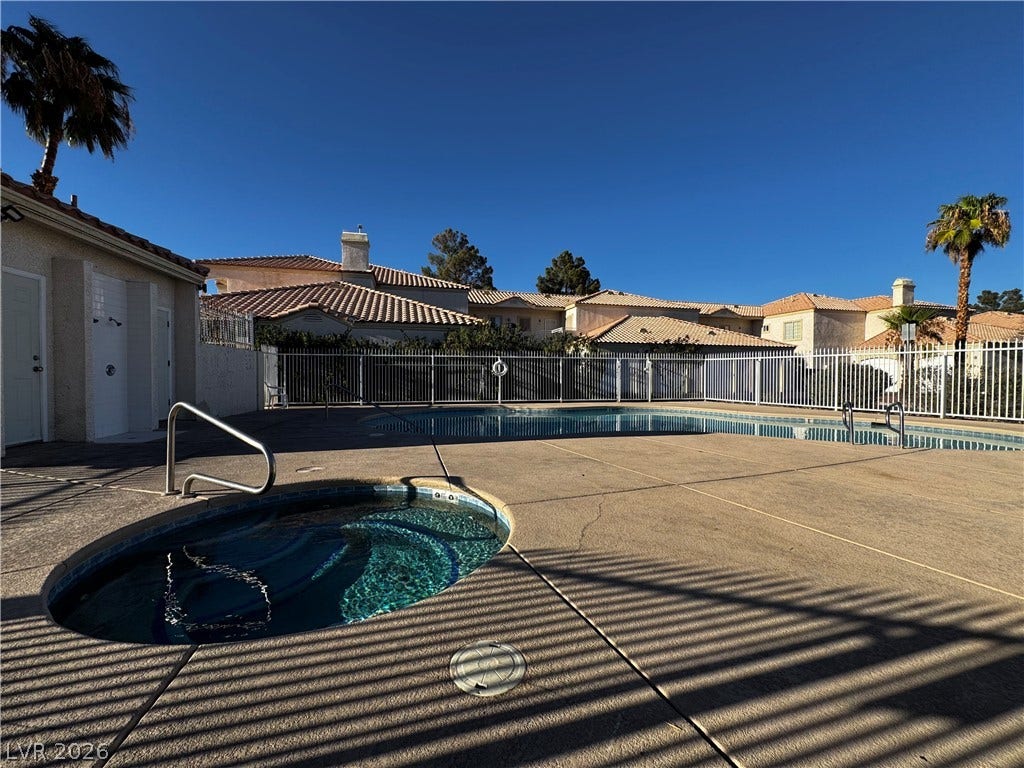 1900 N Torrey Pines Drive, #101, Las Vegas, NV 89108 A sparkling community pool and spa invite relaxation under clear blue desert skies.