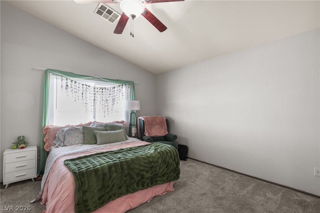 7066 Shimmering Avenue, Henderson, NV 89011 Vaulted ceilings add an airy dimension to this comfortable second bedroom.