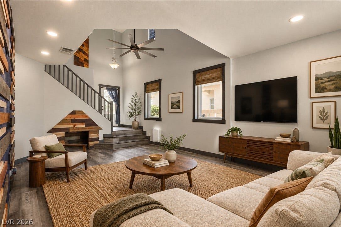 7066 Shimmering Avenue, Henderson, NV 89011 **Virtually Staged** A spacious living area displays soaring vaulted ceilings and rich wood-look flooring.