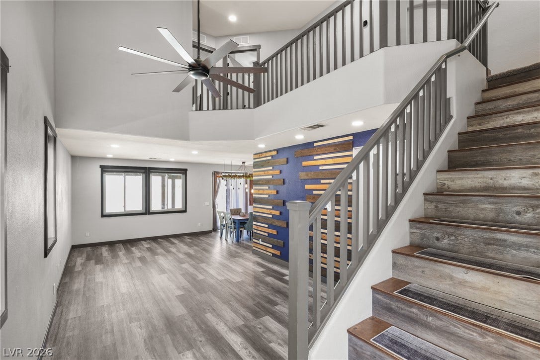 7066 Shimmering Avenue, Henderson, NV 89011 Cathedral ceilings, warm natural light, upgraded flooring, & a massive ceiling fan to keep you cool during the heat of the summer.