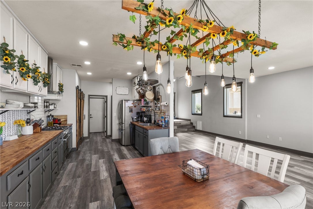 7066 Shimmering Avenue, Henderson, NV 89011 Gleaming wood-look flooring connects this modern culinary space directly to the dining area.