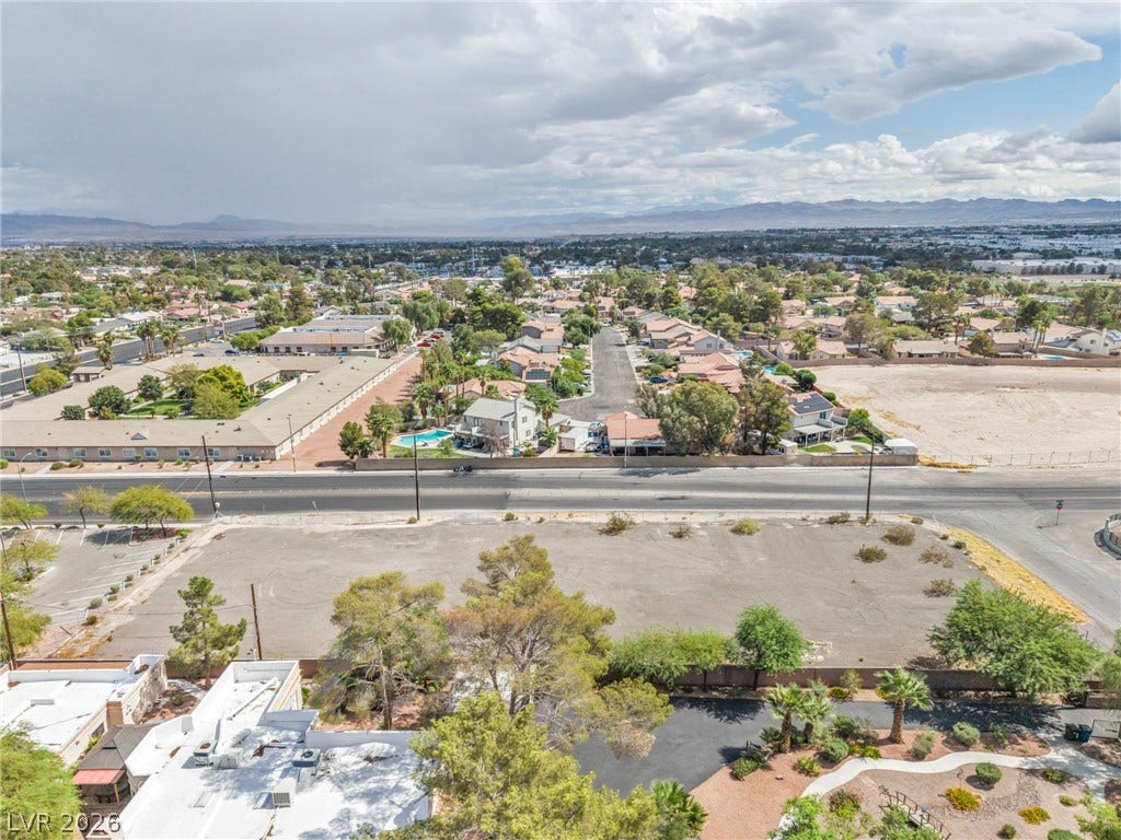 E Quail, Las Vegas, NV 89120 An aerial perspective reveals the expansive surrounding neighborhood and distant mountain views.