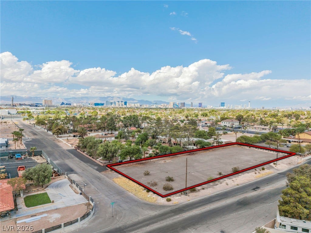 E Quail, Las Vegas, NV 89120 An expansive cleared lot displays development potential with distant city skyline views.