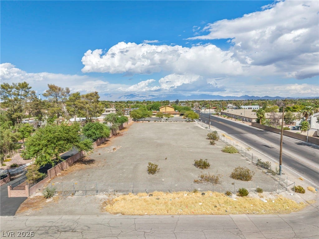 E Quail, Las Vegas, NV 89120 An expansive level lot offers immense potential with nearby street access and mountain views.