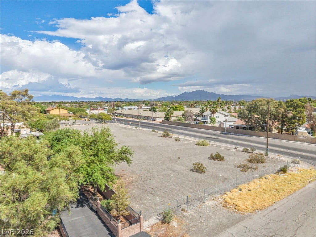 E Quail, Las Vegas, NV 89120 Distant mountains frame this spacious lot lined with native desert greenery under open skies.