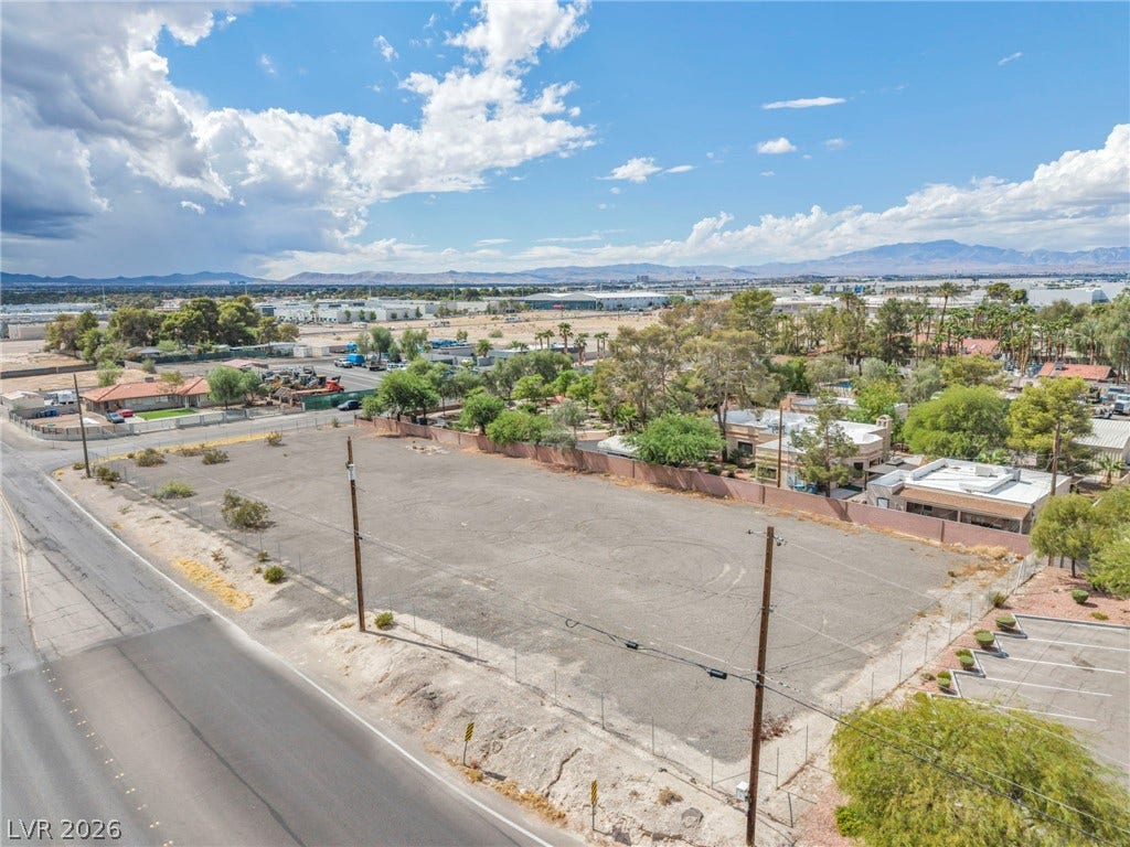 E Quail, Las Vegas, NV 89120 A spacious level lot sits positioned along a paved street with mountain views beyond.