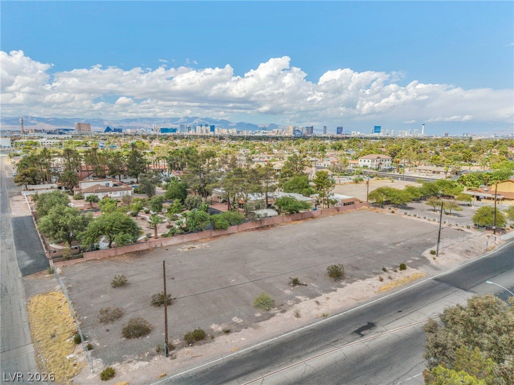 E Quail, Las Vegas, NV 89120 An expansive cleared lot offers panoramic views of the distant city skyline under open skies.