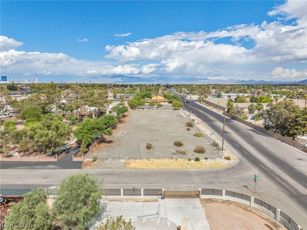 E Quail, Las Vegas, NV 89120 Distant mountains frame the horizon of this vast parcel near paved streets.