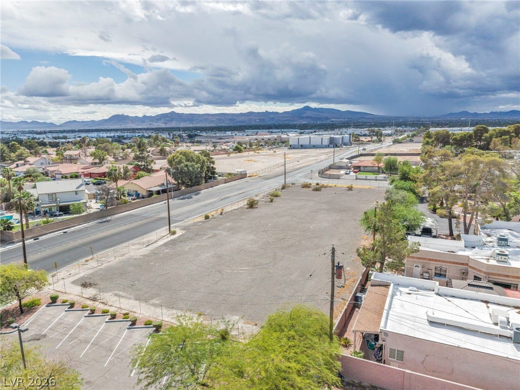E Quail, Las Vegas, NV 89120 Distant mountains frame this expansive parcel positioned along a paved roadway.