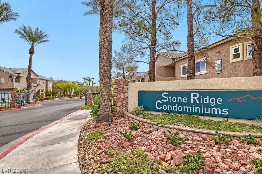 An inviting gated entrance welcomes residents to this beautifully landscaped residential community.