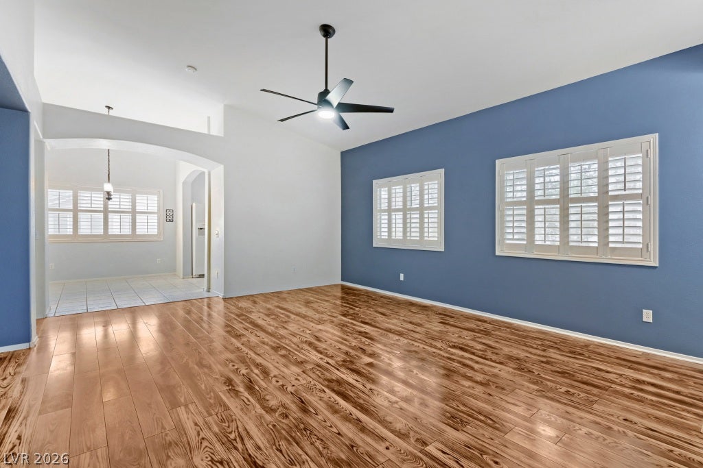 Polished hardwood floors and clean architectural lines define this airy, open-concept living space.