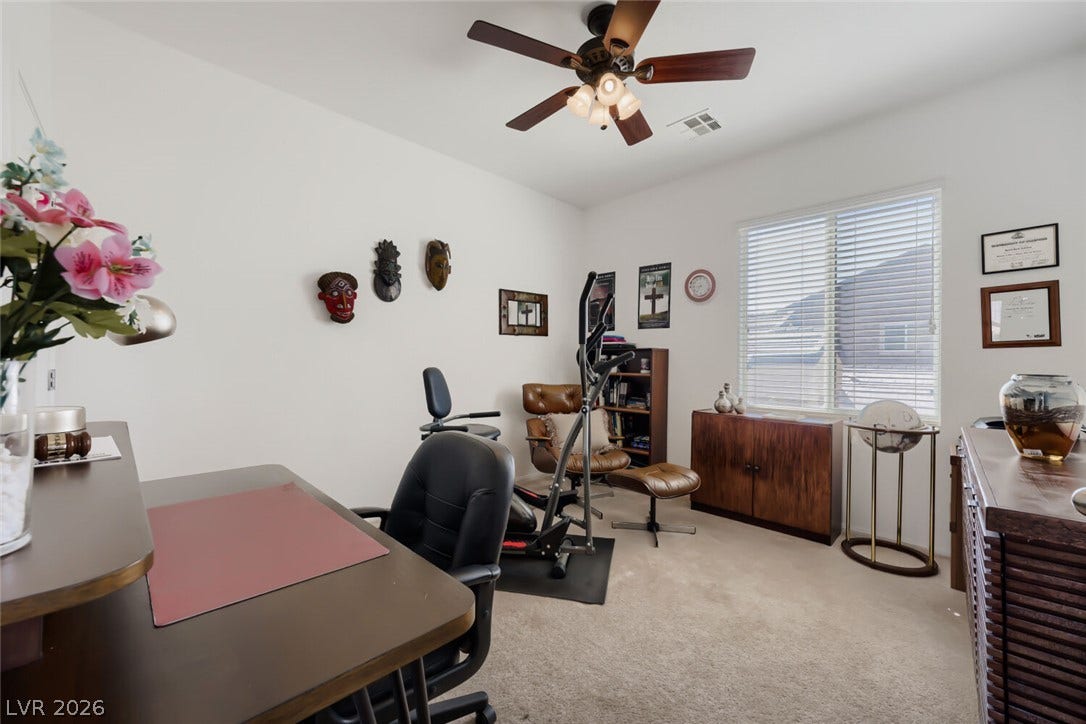 109 Spur Ranch Avenue, North Las Vegas, NV 89032 Plentiful natural light fills this versatile space finished with neutral carpeting.