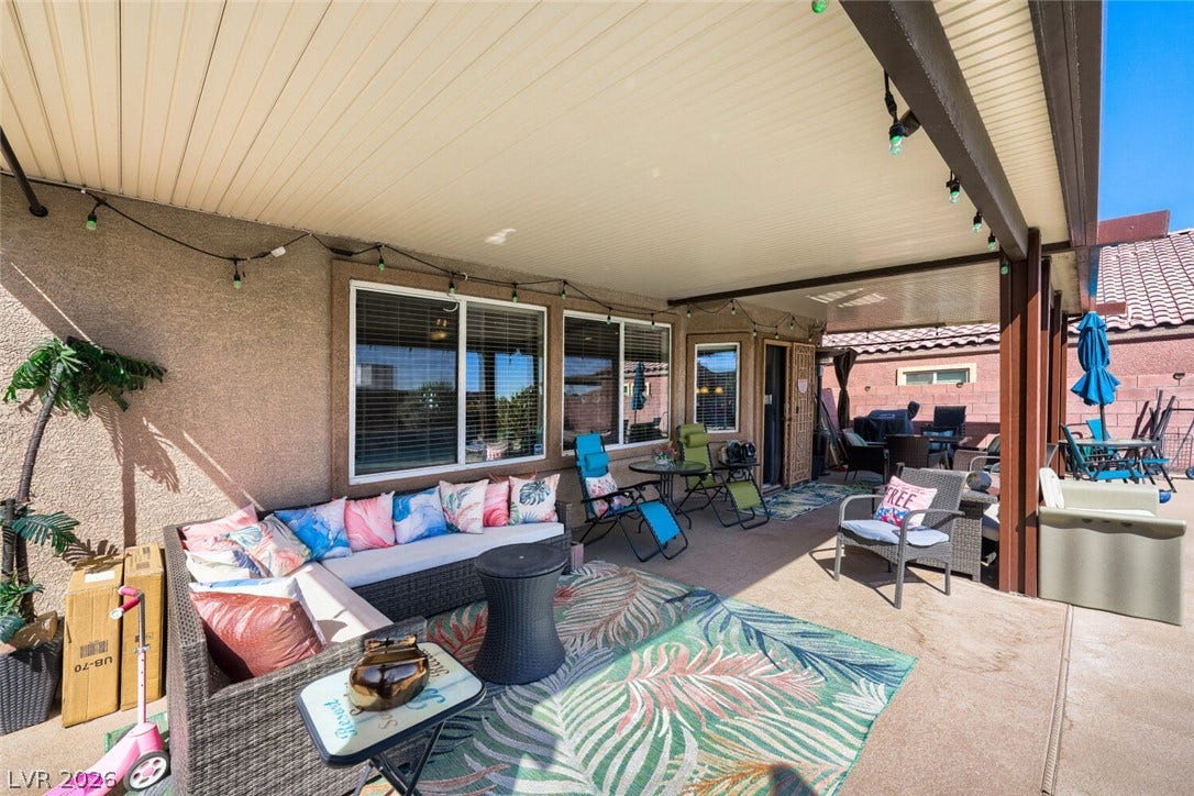 109 Spur Ranch Avenue, North Las Vegas, NV 89032 A spacious covered patio provides a shaded retreat for outdoor relaxation and entertainment.