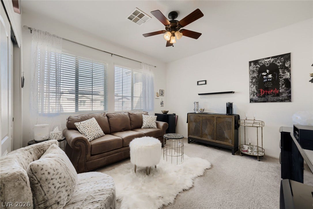 109 Spur Ranch Avenue, North Las Vegas, NV 89032 Generous windows invite abundant natural light into this versatile secondary living space.
