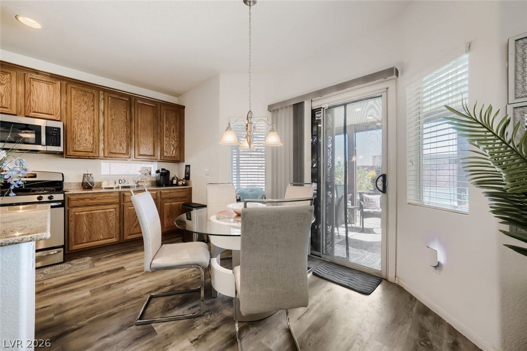 109 Spur Ranch Avenue, North Las Vegas, NV 89032 Sliding glass doors connect the casual dining area to the outdoor patio.