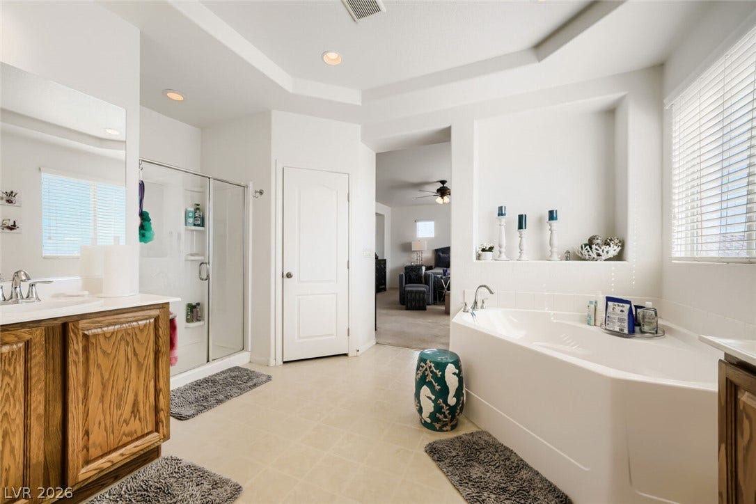 109 Spur Ranch Avenue, North Las Vegas, NV 89032 An alcove soaking tub and separate shower stall highlight this spacious layout.