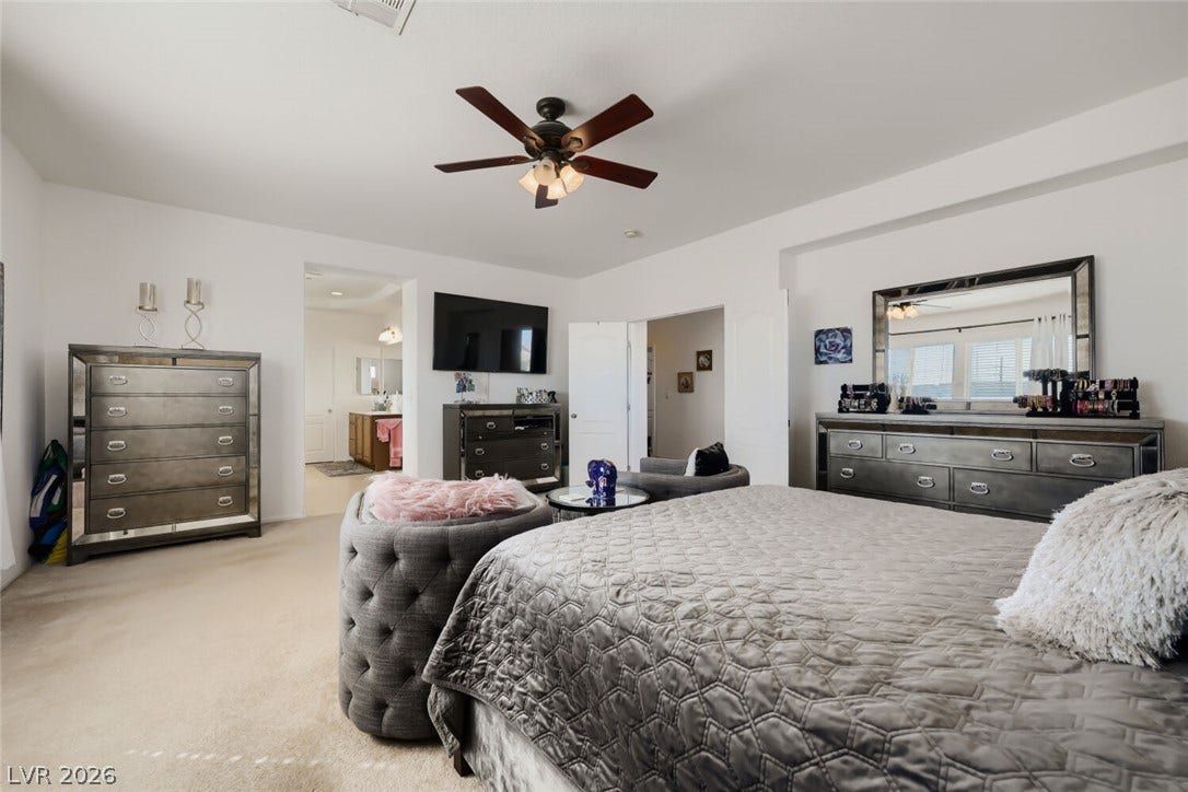 109 Spur Ranch Avenue, North Las Vegas, NV 89032 Plush wall-to-wall carpeting and smooth tray ceilings highlight this generous bedroom suite.
