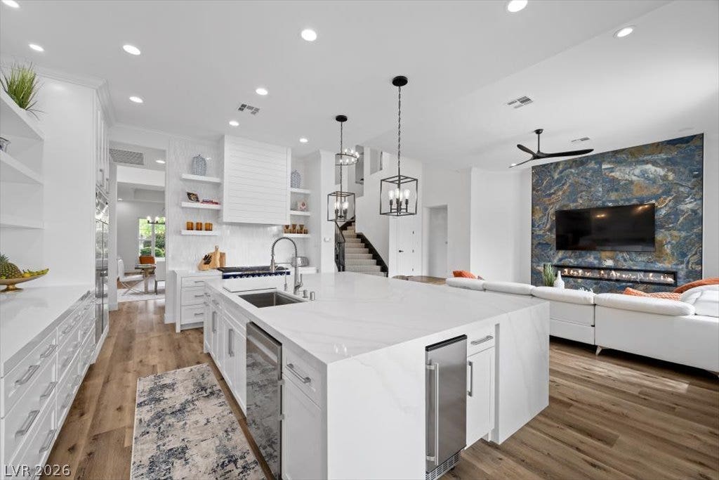 9521 Queen Charlotte Drive, Las Vegas, NV 89145 An open floor plan seamlessly connects the gourmet kitchen to the main living area.