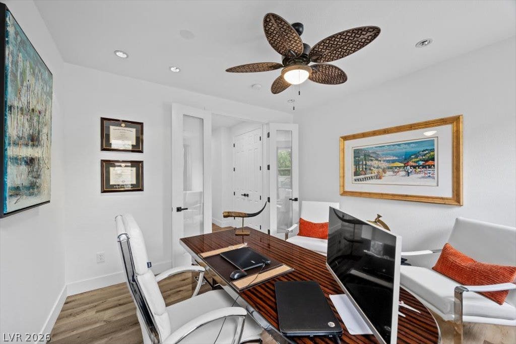 9521 Queen Charlotte Drive, Las Vegas, NV 89145 Double glass doors open to a bright workspace featuring recessed lighting and hardwood floors.