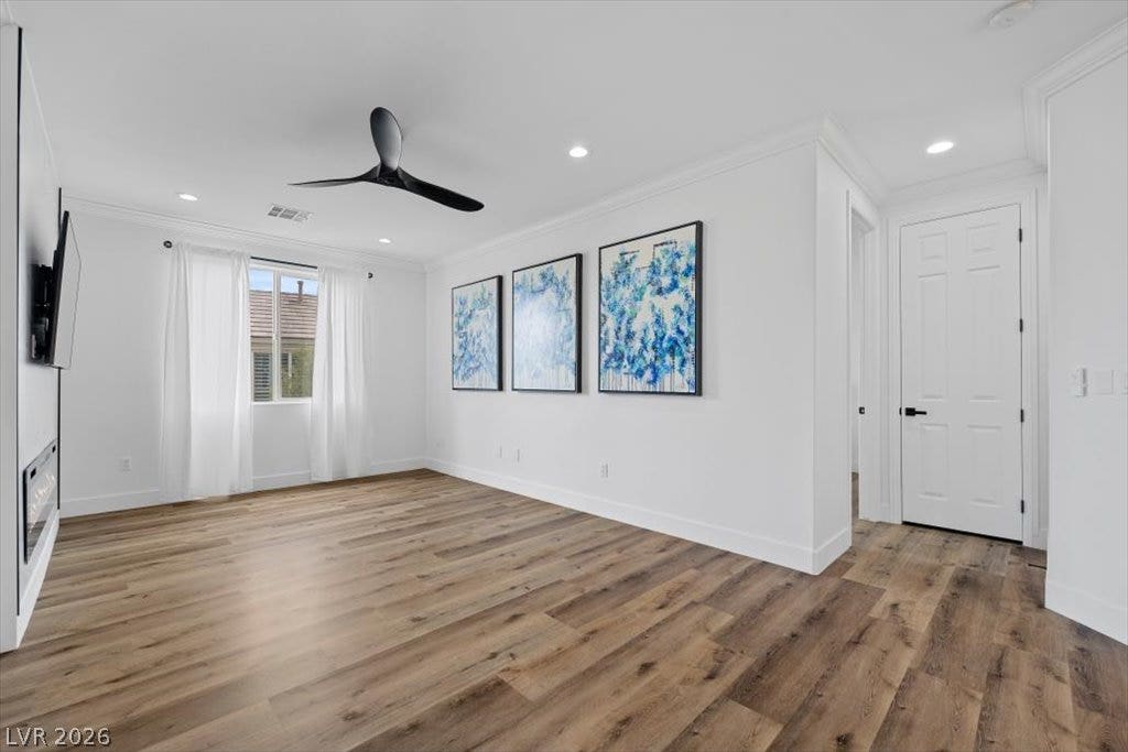 9521 Queen Charlotte Drive, Las Vegas, NV 89145 Rich wood flooring pairs with clean lines in this light-filled modern living space.
