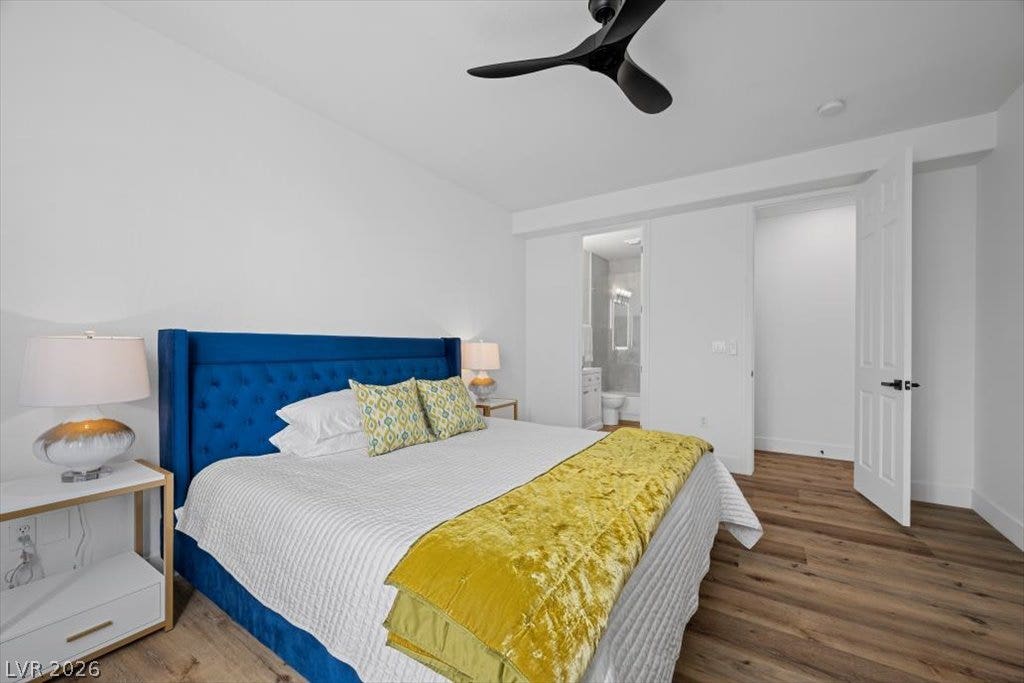 9521 Queen Charlotte Drive, Las Vegas, NV 89145 Gleaming wood floors anchor this bedroom featuring an adjoining bathroom.