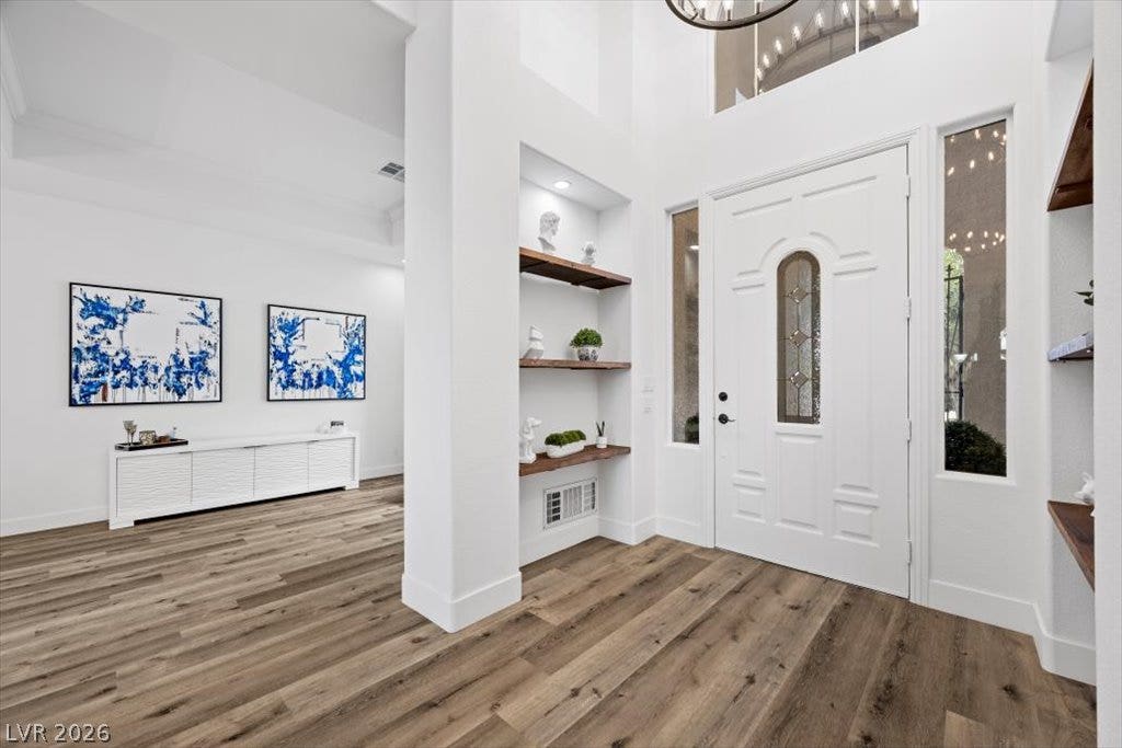9521 Queen Charlotte Drive, Las Vegas, NV 89145 Light hardwood floors complement a soaring ceiling in this welcoming entrance foyer.