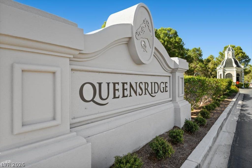 9521 Queen Charlotte Drive, Las Vegas, NV 89145 A grand monument sign marks the entry to this guard-gated residential community.