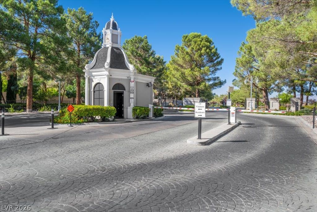 9521 Queen Charlotte Drive, Las Vegas, NV 89145 An elegant guard pavilion anchors the secure entry gate of this exclusive gated community.