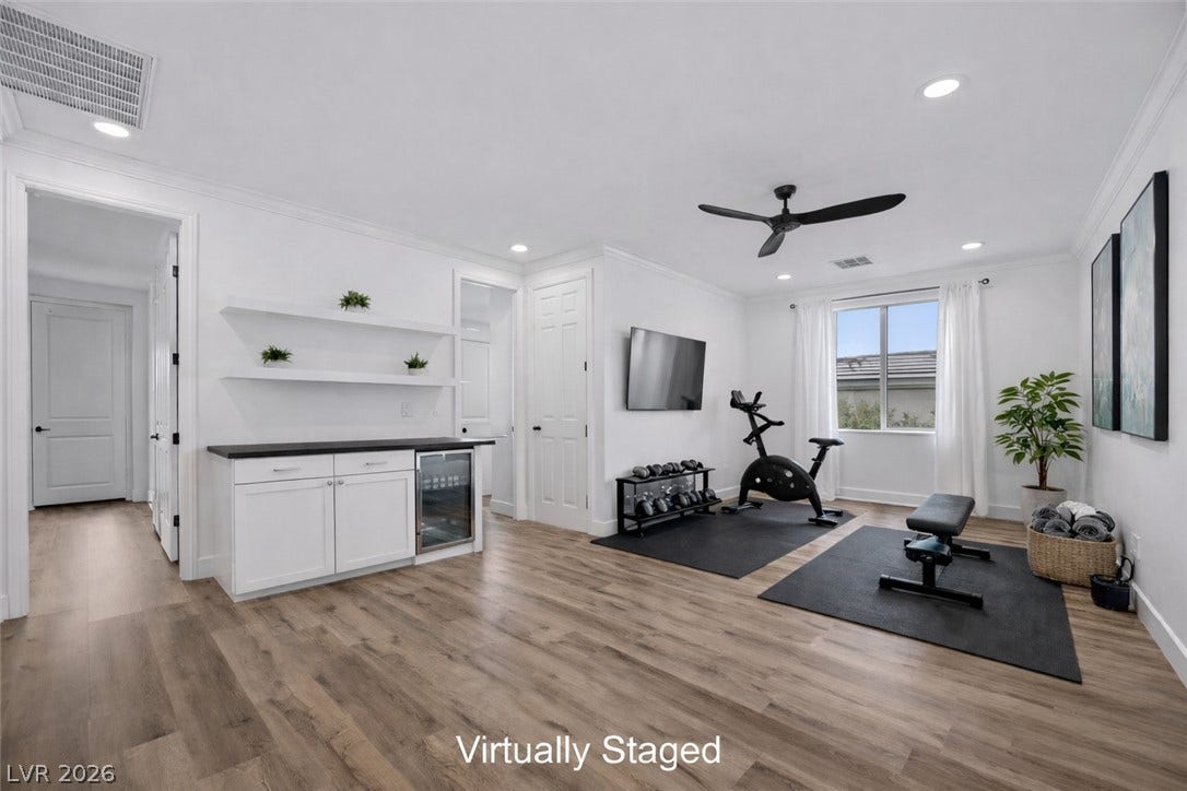 9521 Queen Charlotte Drive, Las Vegas, NV 89145 Gleaming hardwood floors and crisp recessed lighting define this versatile multi-use recreation space.