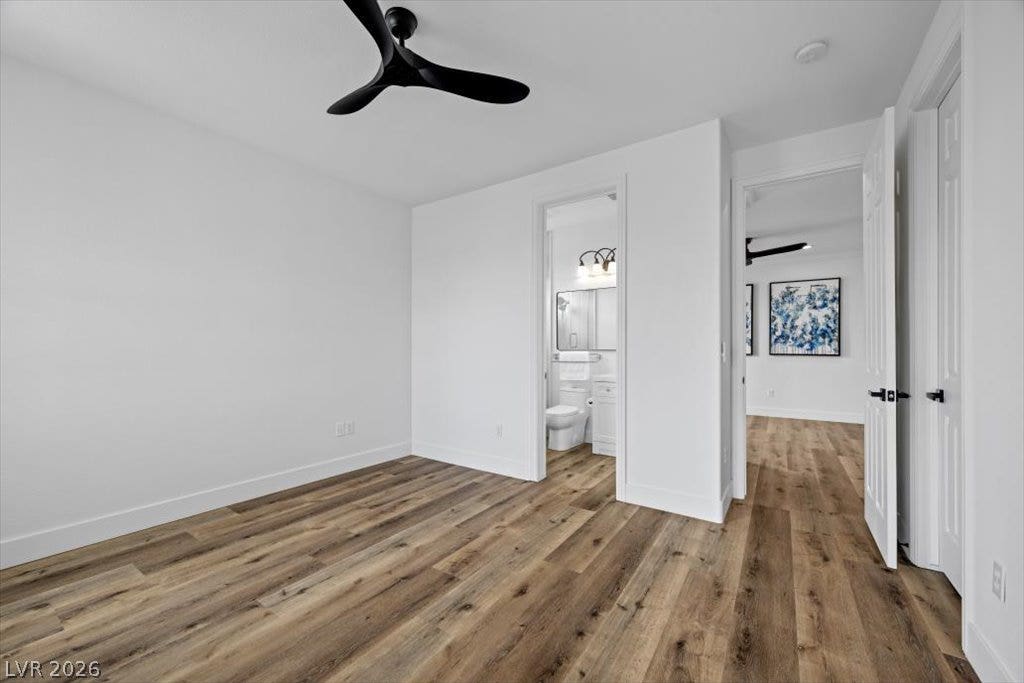 9521 Queen Charlotte Drive, Las Vegas, NV 89145 Rich wood floors lay a beautiful foundation beneath crisp white walls.