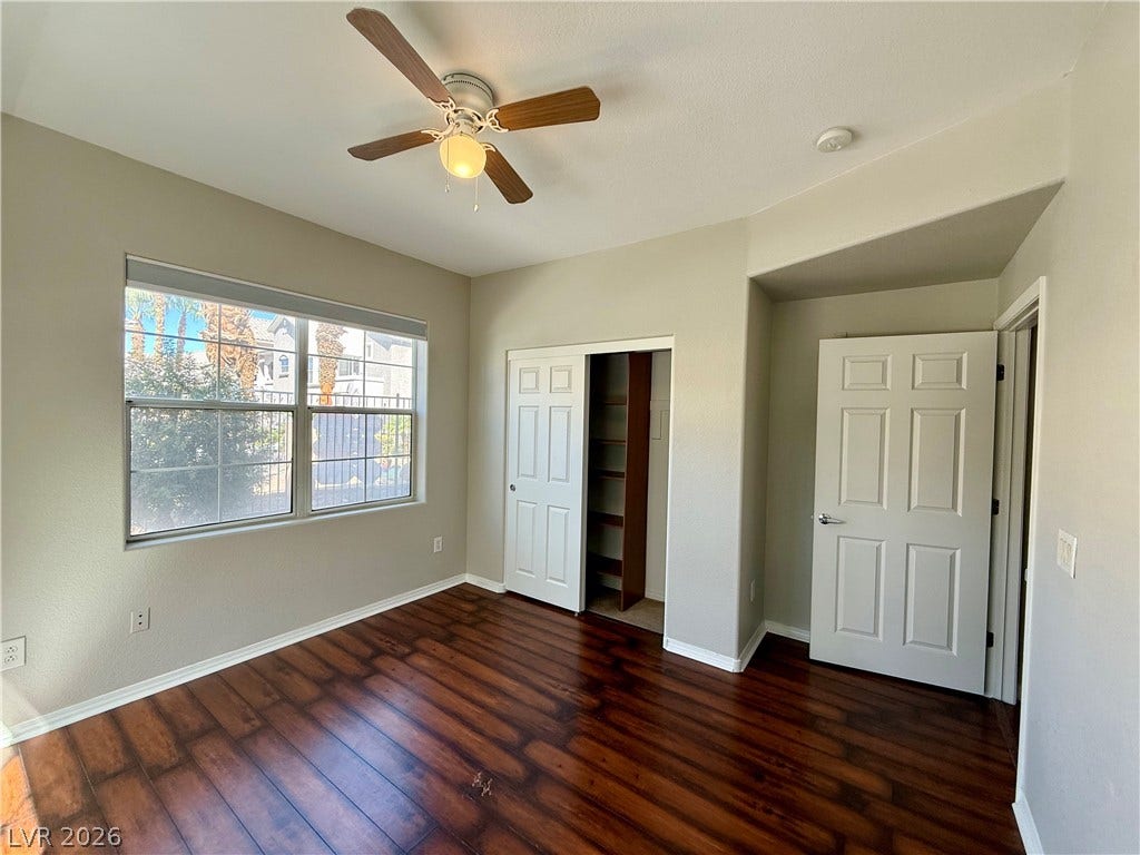 8777 W Maule Avenue, #1094, Las Vegas, NV 89148 Rich wood flooring pairs with natural light streaming through a large window.