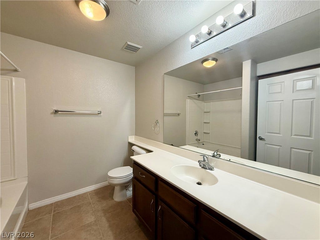 8777 W Maule Avenue, #1094, Las Vegas, NV 89148 Tiled flooring and a spacious vanity complete this well-appointed bathroom.