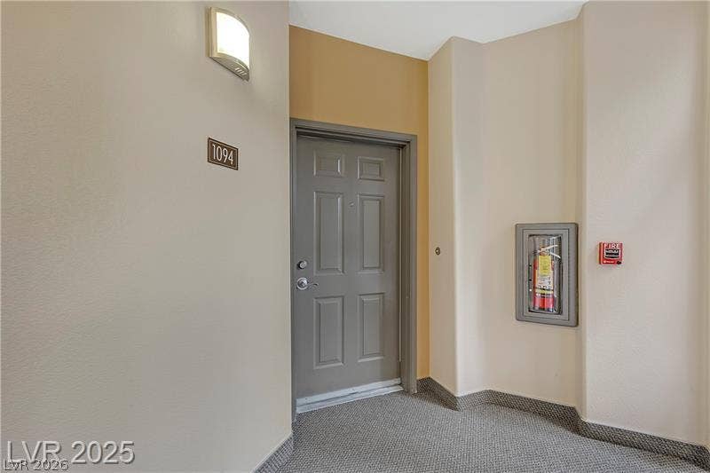 8777 W Maule Avenue, #1094, Las Vegas, NV 89148 Welcoming entrance alcove featuring a secure panel door and durable patterned carpet flooring.