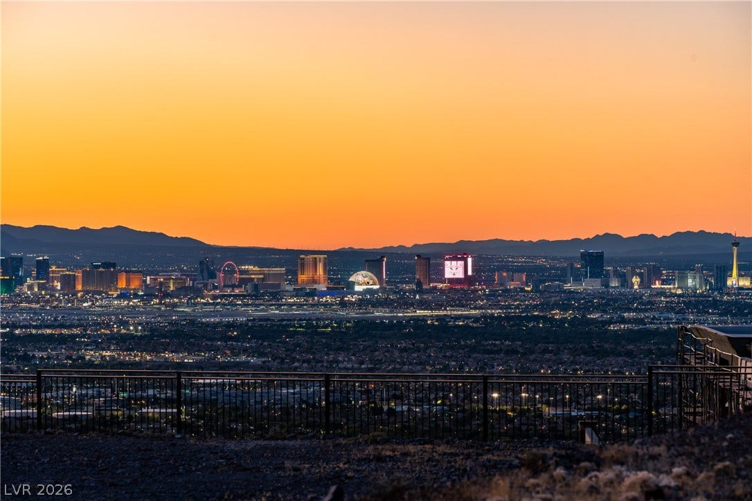 7 Sunset Strip, Henderson, NV 89012 Panoramas of the twinkling city skyline unfold against a mountain backdrop.