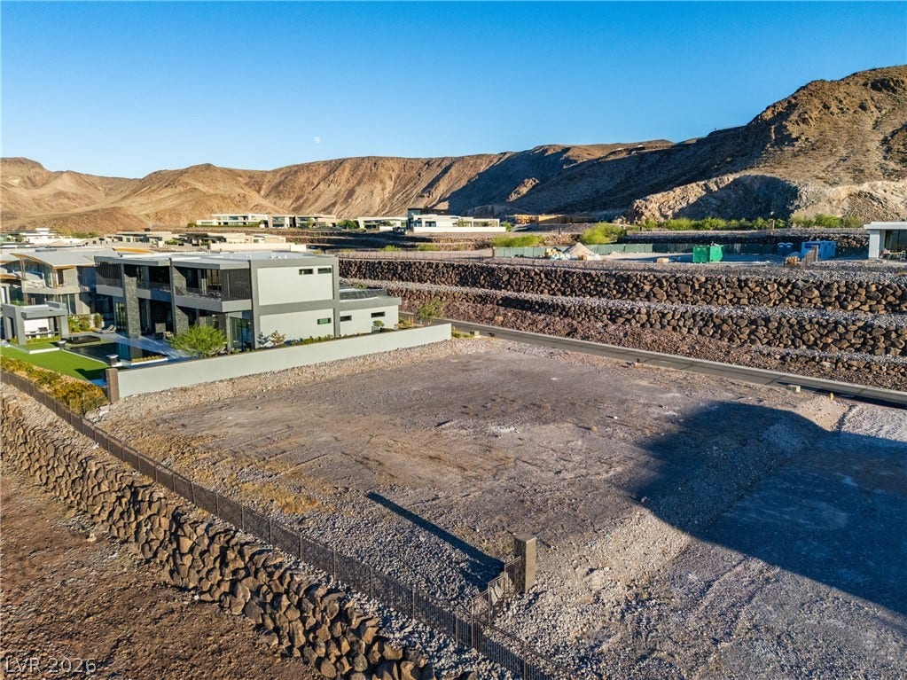 7 Sunset Strip, Henderson, NV 89012 An elevated perspective reveals a graded buildable lot nestled against a dramatic mountain backdrop.