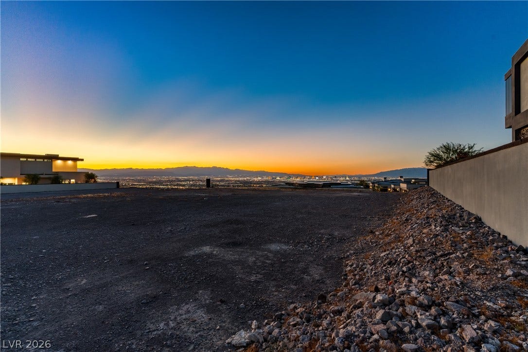 7 Sunset Strip, Henderson, NV 89012 Sweeping mountain and city lights vistas frame this premier building lot at sunset.