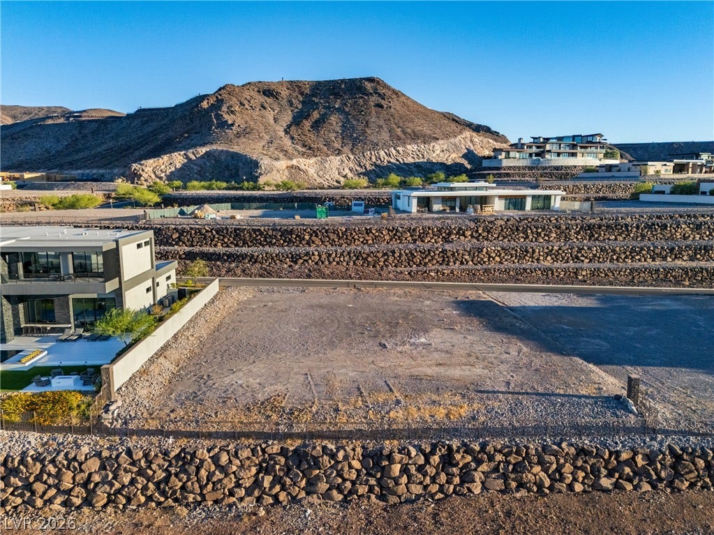7 Sunset Strip, Henderson, NV 89012 Dramatic mountain vistas rise behind this cleared hillside homesite nestled within a terraced desert community.