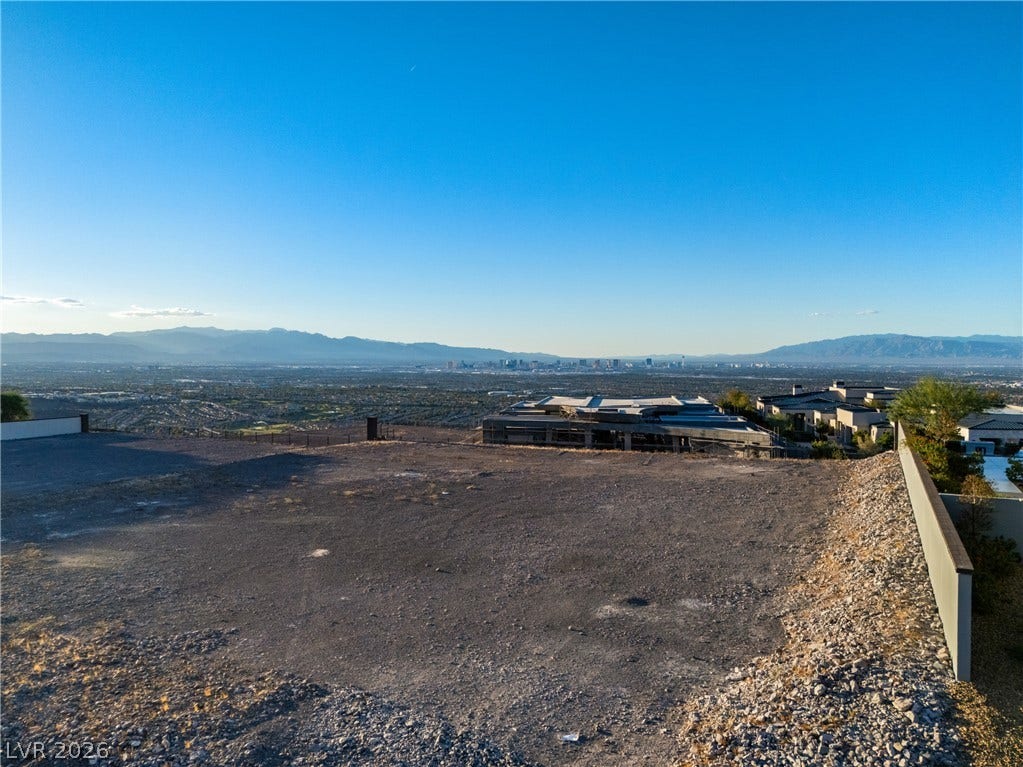7 Sunset Strip, Henderson, NV 89012 Panoramic mountain and city skyline views frame this elevated build-ready lot.