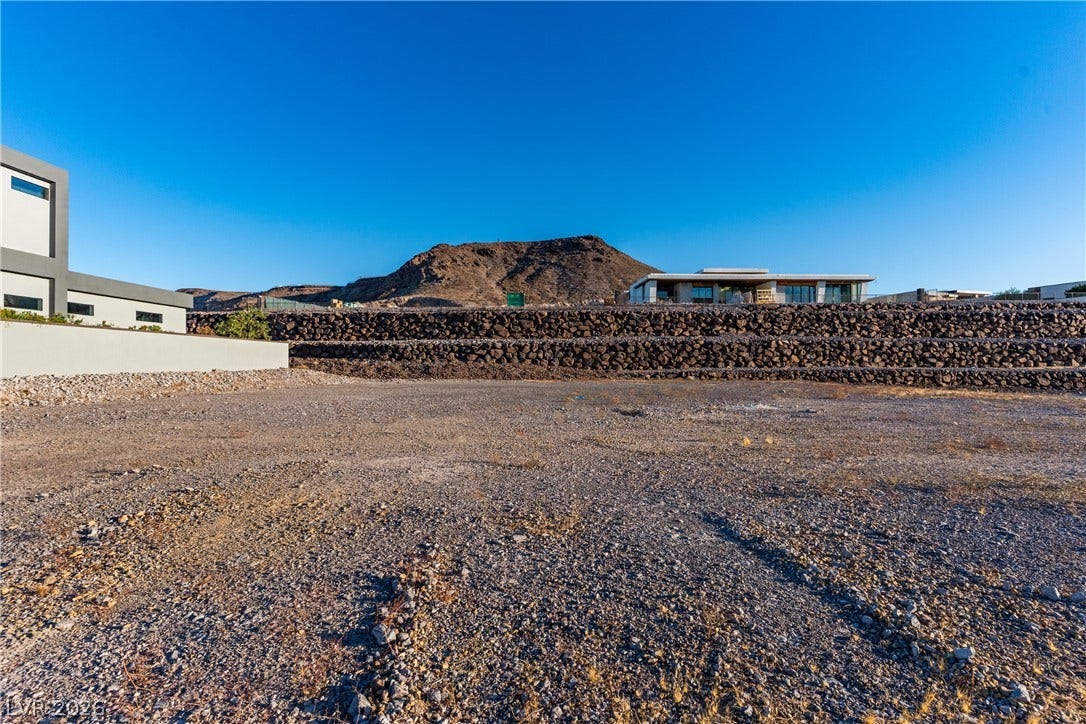 7 Sunset Strip, Henderson, NV 89012 Expansive desert lot offers sweeping mountain views under clear blue skies.