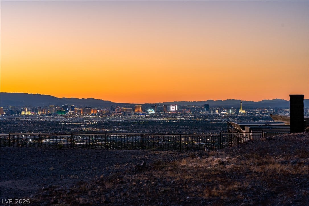 7 Sunset Strip, Henderson, NV 89012 Panoramic mountain and city light views stretch across the horizon at sunset.