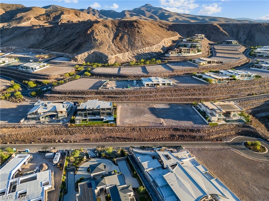 7 Sunset Strip, Henderson, NV 89012 Dramatic mountain backdrops frame a terraced hillside neighborhood with modern architectural homes.