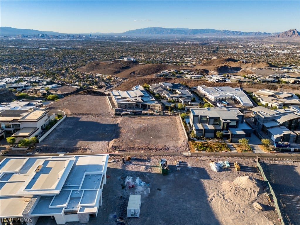 7 Sunset Strip, Henderson, NV 89012 A spacious vacant lot sits prepared for construction amid a hillside neighborhood with sweeping valley views.