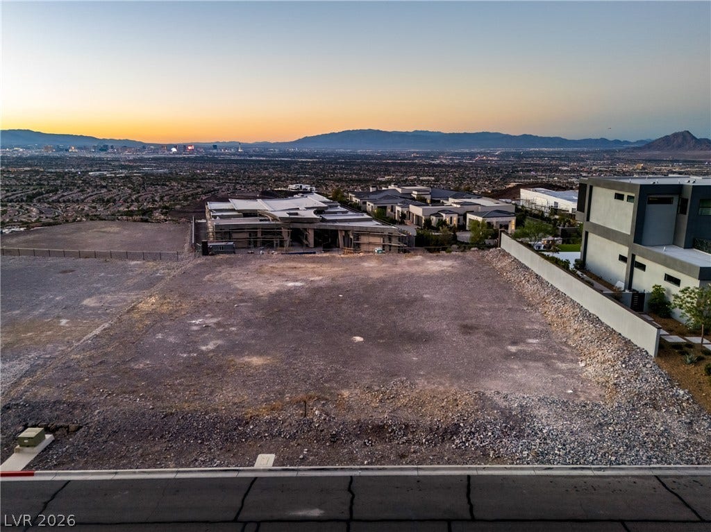 7 Sunset Strip, Henderson, NV 89012 An elevated perspective showcases a graded building pad overlooking the surrounding valley and distant mountains.