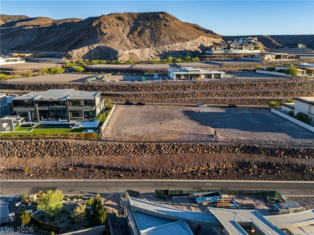 7 Sunset Strip, Henderson, NV 89012 A prime building lot framed by terraced stone walls and dramatic mountain backdrops.