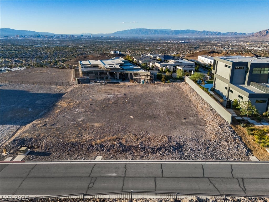 7 Sunset Strip, Henderson, NV 89012 An elevated perspective reveals a spacious hillside lot overlooking the distant city skyline.
