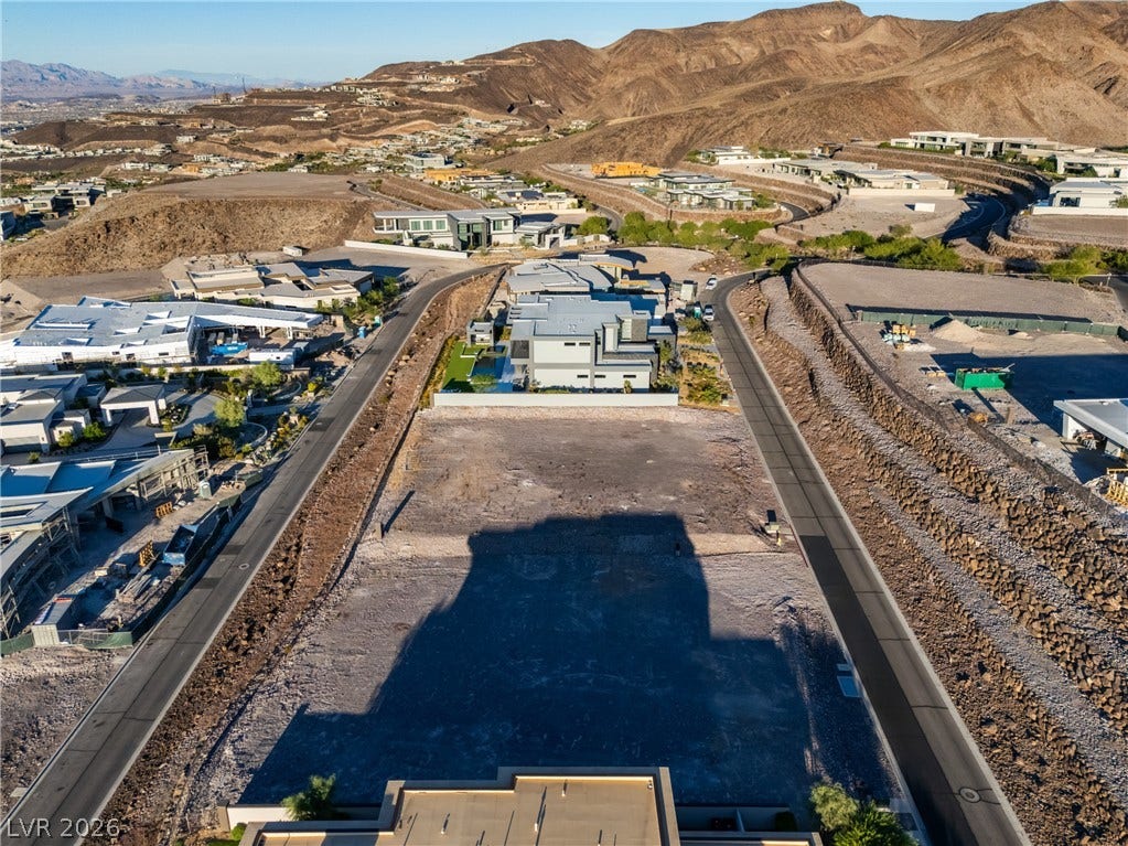 7 Sunset Strip, Henderson, NV 89012 Elevated view reveals a vacant buildable lot nestled within a modern desert hillside development.
