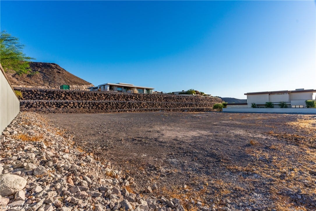 7 Sunset Strip, Henderson, NV 89012 Graded building lot framed by stone retaining walls awaits a custom architectural design.