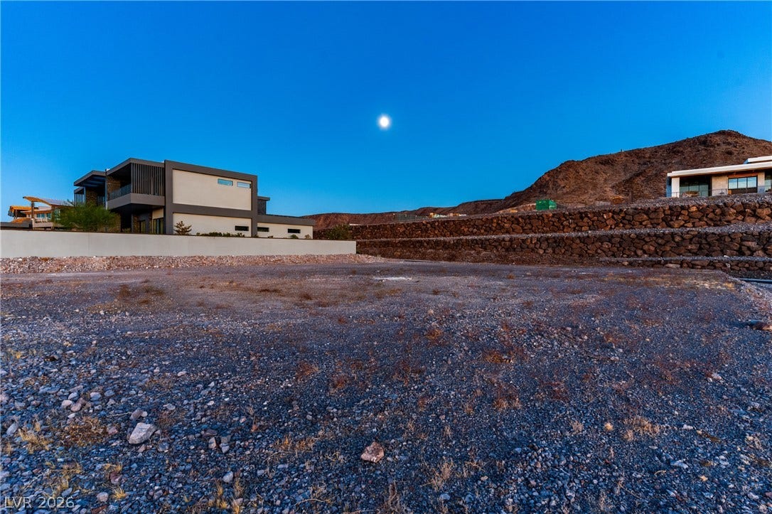 7 Sunset Strip, Henderson, NV 89012 An expansive graded building site sits nestled against a dramatic mountain backdrop.