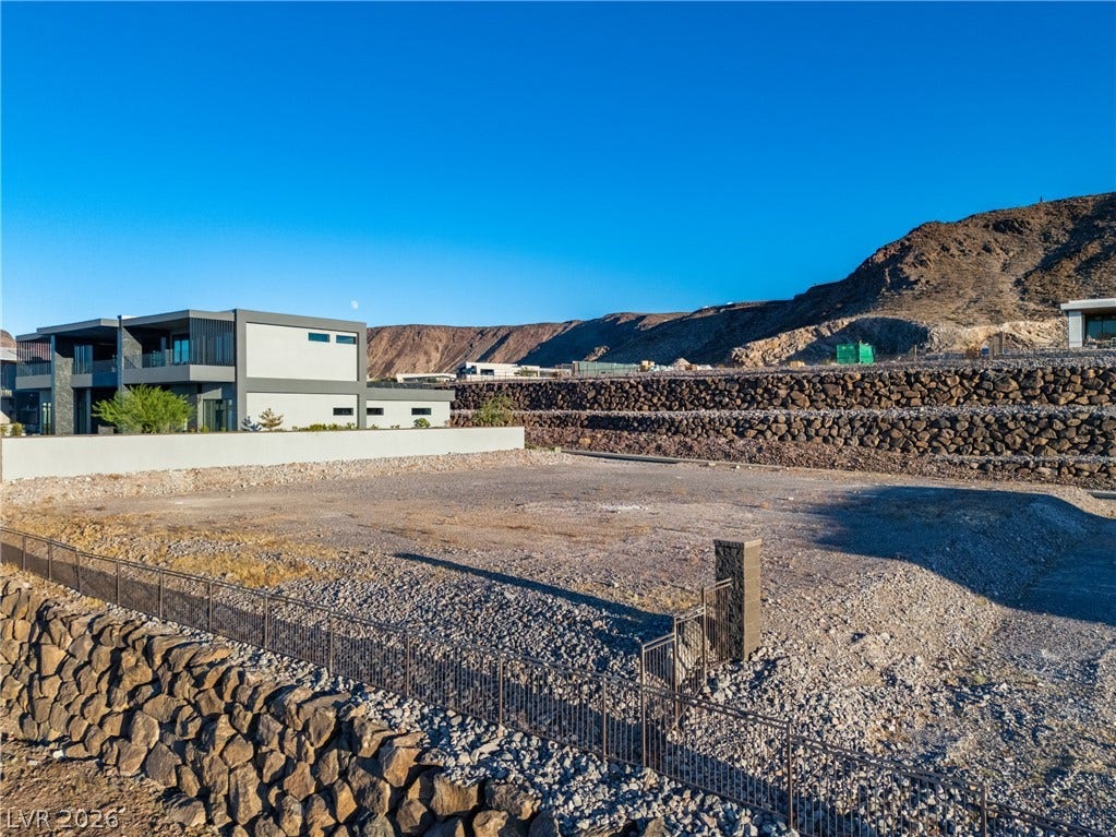 7 Sunset Strip, Henderson, NV 89012 A graded hillside lot stands ready for development against a dramatic mountain backdrop.